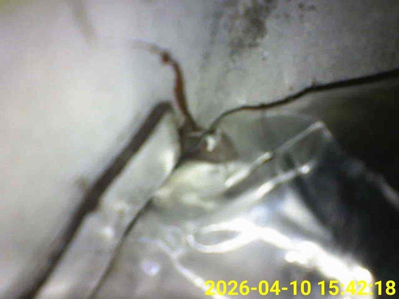 Completed scheduled heating system maintenance inspection. Accessed and examined HVAC ductwork and mechanical components in confined ceiling cavity space, verifying proper installation of flexible ductwork, support mechanisms, and metallic connections. All accessible heating system components were visually inspected and found to be properly secured and functioning as designed.