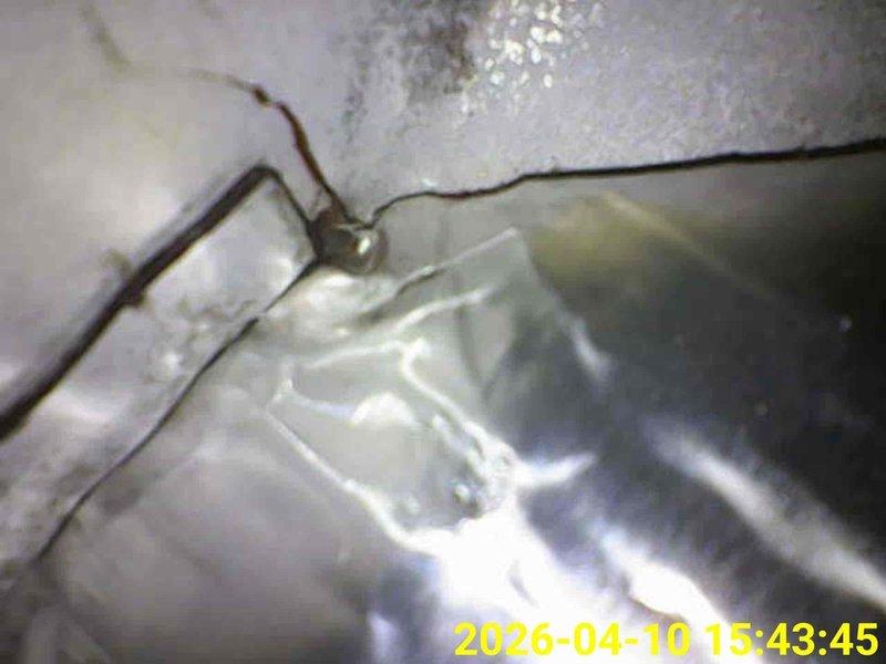 Completed scheduled heating system maintenance inspection. Accessed and examined HVAC ductwork and mechanical components in confined ceiling cavity space, verifying proper installation of flexible ductwork, support mechanisms, and metallic connections. All accessible heating system components were visually inspected and found to be properly secured and functioning as designed.