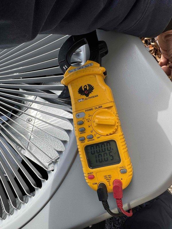 Completed routine HVAC cooling maintenance on residential outdoor condensing unit. Performed comprehensive system diagnostics including electrical testing with multimeter, recording voltage and amperage readings to verify proper compressor and fan motor operation within manufacturer specifications. Unit exterior, coil fins, and surrounding area inspected and found to be in clean, functional condition with no visible damage or operational concerns noted.