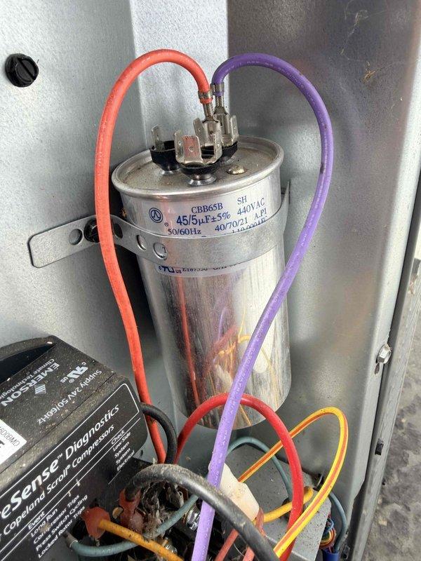 Completed comprehensive HVAC tune-up service on residential unit. Customer reported increased runtime following previous service work from October. Performed standard maintenance protocol including inspection of electrical connections at terminal block, verified proper wire terminations and tightness of all connection screws, and examined capacitor for proper operation and secure mounting. All electrical components, including capacitor (CBB65B 440VAC rated), wiring harnesses, and control board connections were inspected and found to be functioning within normal parameters with no immediate concerns identified.