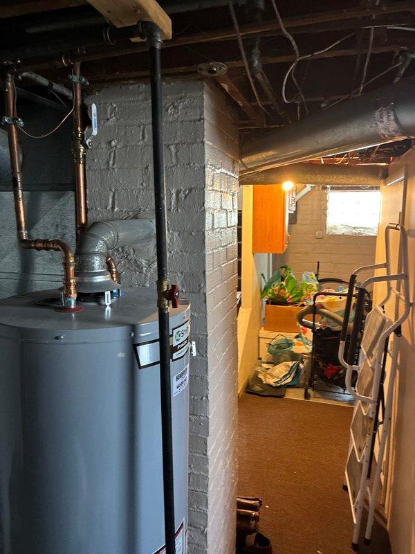 Completed furnace replacement estimate for unit with failed heat exchanger that was disabled at thermostat for safety. Documented existing basement utility installation including water heater, electrical panel configuration, and available workspace for equipment replacement. Provided homeowner with furnace replacement options and specifications.