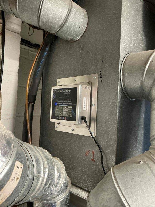 Responded to customer complaint regarding thermostat not reaching setpoint temperature. Customer reported thermostat set to 68°F but system only heating to 64°F. Inspected HVAC system including furnace, ductwork, and Air Scrubber unit mounted in mechanical room. Presented maintenance value plan information to customer outlining annual tune-up services and diagnostic benefits.