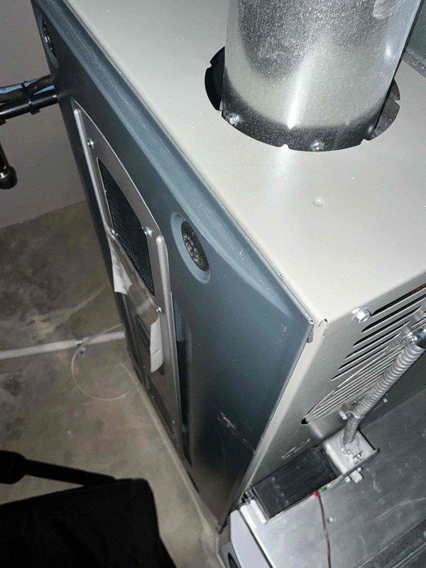Completed HVAC system replacement estimate for attic-installed air handling unit experiencing recurring refrigerant leaks. Documented existing equipment configuration including air handler with accessible service panels, supply ductwork, and associated drainage and refrigerant line connections in preparation for full system replacement.