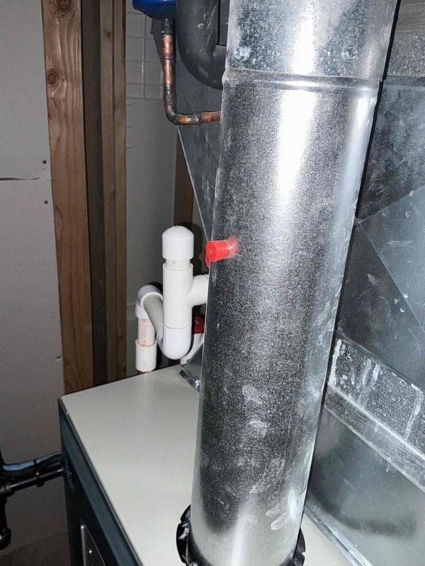 Completed HVAC system replacement estimate for attic-installed air handling unit experiencing recurring refrigerant leaks. Documented existing equipment configuration including air handler with accessible service panels, supply ductwork, and associated drainage and refrigerant line connections in preparation for full system replacement.