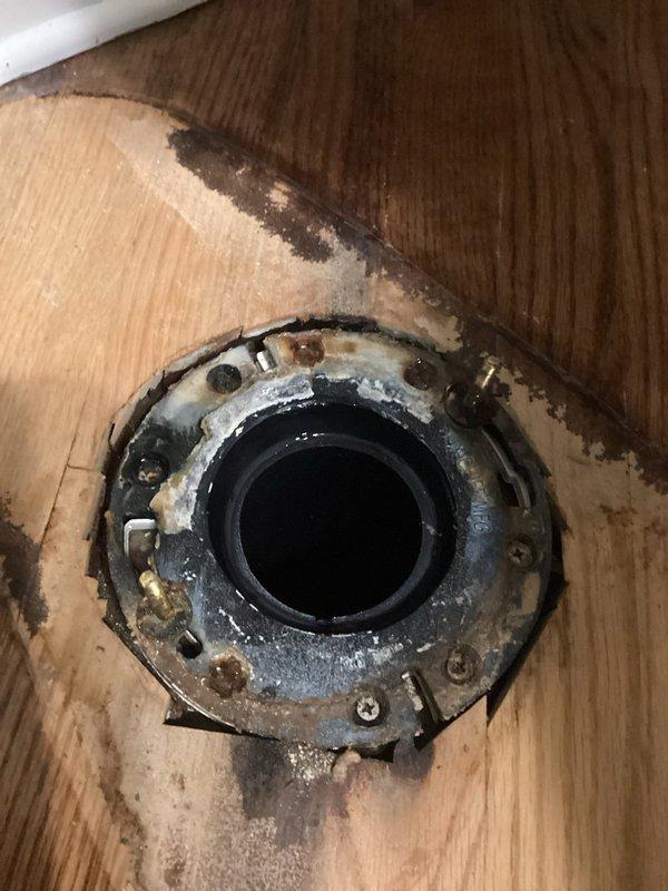 Responded to emergency water leak call with reported ceiling damage above shower stall. Upon arrival, documented extensive water damage to shower ceiling with visible discoloration, staining, and potential mold growth, along with corroded plumbing fixture in adjacent floor area showing significant rust, mineral deposits, and deteriorated surrounding subflooring. Photographed affected areas for documentation and further assessment by appropriate trades for repair.
