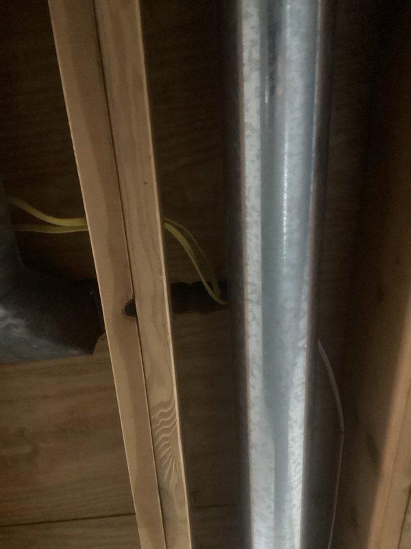 Installed new electric baseboard heater in bathroom. Ran electrical wiring through attic space to supply dedicated circuit for heating unit. Mounted baseboard heater at floor level along wall near shower enclosure, ensuring proper clearances from plumbing fixtures and moisture sources per code requirements.