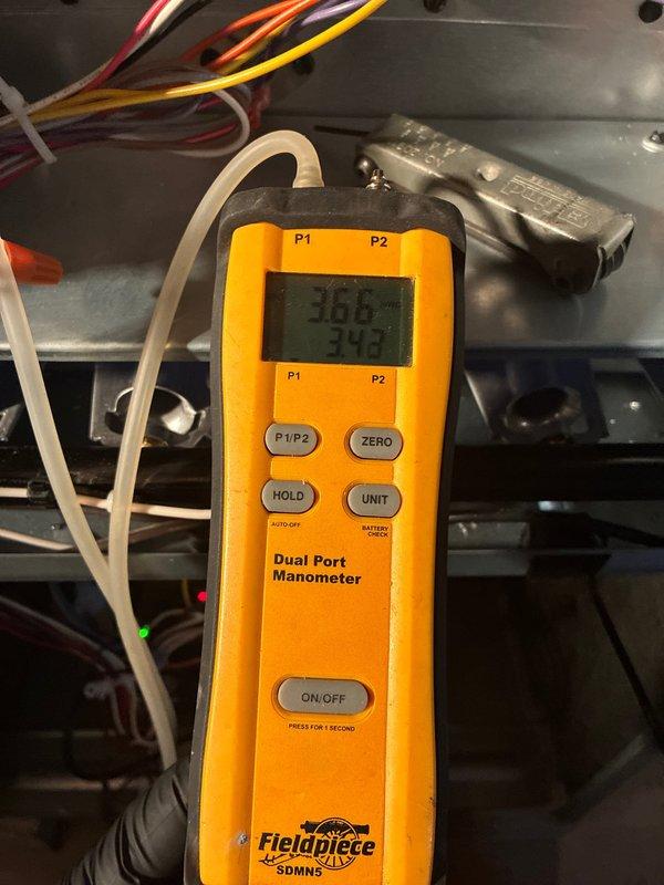 Completed full HVAC system installation including 80% efficiency furnace, air conditioning unit, and return drop. Verified system operation with digital manometer readings showing proper static pressure at 3.01" and temperature differential of 34.9°F. Installed and programmed Honeywell Home ProSeries thermostat for optimal climate control. All equipment tested and confirmed operational to manufacturer specifications.