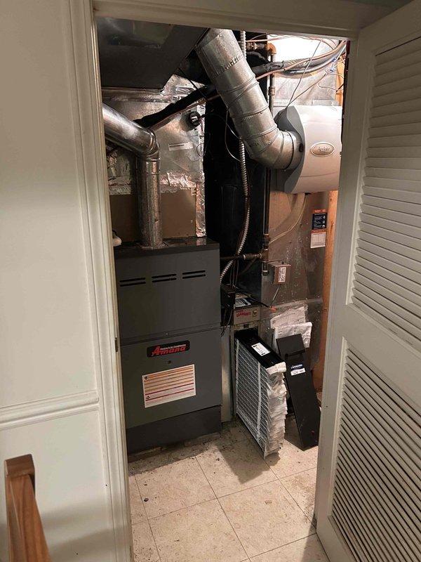 Completed comprehensive cooling maintenance on Amana HVAC system. Performed standard seasonal inspection of indoor furnace/air handler unit located in utility closet and outdoor condensing unit, including filter check, ductwork inspection, and verification of all system components operating within normal parameters. Documented equipment condition through photographic records showing properly installed system with flexible ductwork and electrical connections intact.