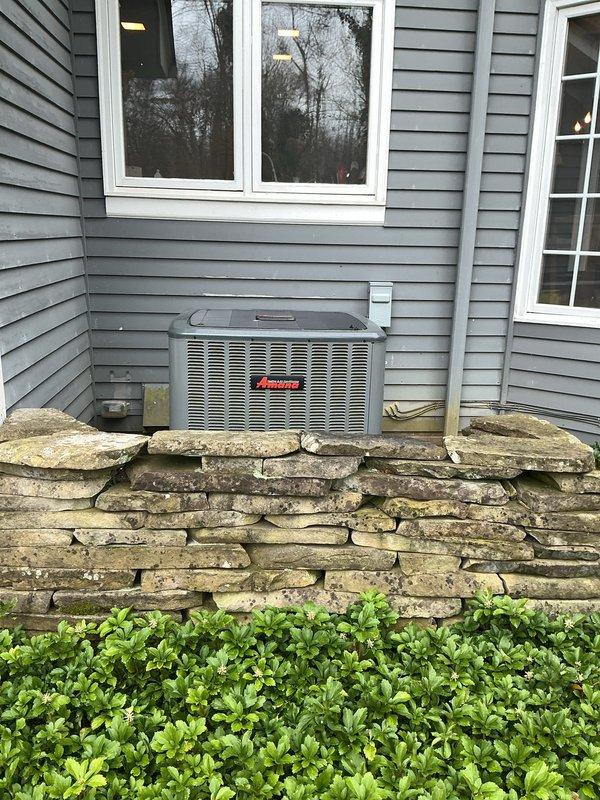 Completed comprehensive cooling maintenance on Amana HVAC system. Performed standard seasonal inspection of indoor furnace/air handler unit located in utility closet and outdoor condensing unit, including filter check, ductwork inspection, and verification of all system components operating within normal parameters. Documented equipment condition through photographic records showing properly installed system with flexible ductwork and electrical connections intact.