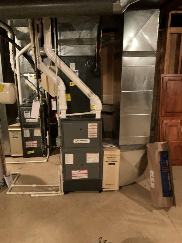 Performed routine maintenance on two residential cooling systems. Inspected indoor furnace and air handler components in basement mechanical room, checking electrical connections, verifying proper airflow through ductwork, and examining condensate drainage lines. Proceeded to exterior location where both condenser units were serviced, including cleaning coils, checking refrigerant levels, testing capacitors, inspecting fan motor operation, and verifying proper electrical connections on both units. All systems operating within normal parameters upon completion of maintenance procedures.