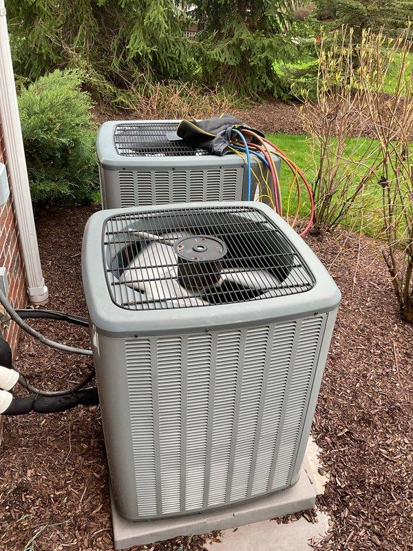 Performed routine maintenance on two residential cooling systems. Inspected indoor furnace and air handler components in basement mechanical room, checking electrical connections, verifying proper airflow through ductwork, and examining condensate drainage lines. Proceeded to exterior location where both condenser units were serviced, including cleaning coils, checking refrigerant levels, testing capacitors, inspecting fan motor operation, and verifying proper electrical connections on both units. All systems operating within normal parameters upon completion of maintenance procedures.