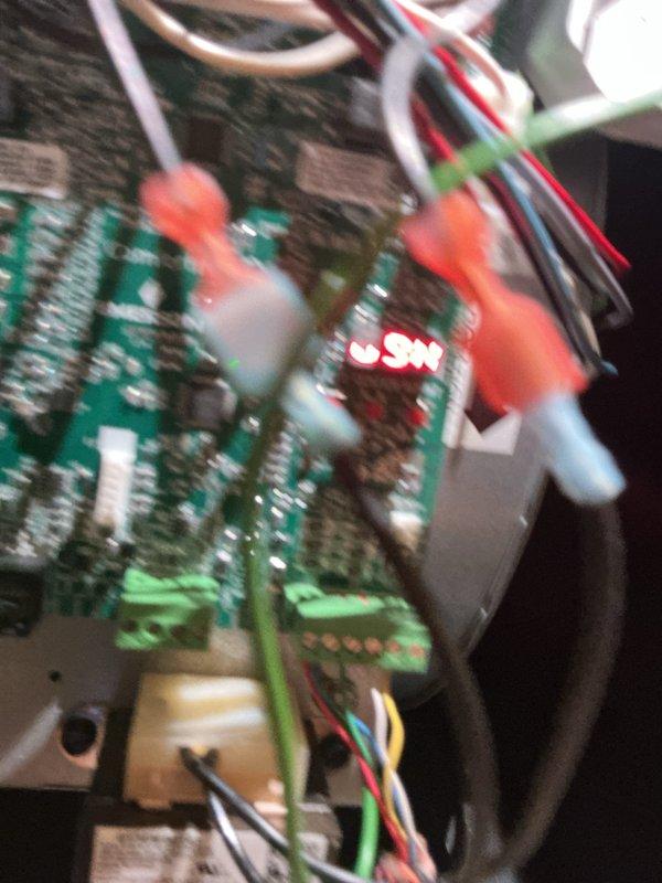 # HVAC Install Warranty Completion

Responded to second service call for HVAC system control board issue. Inspected Emerson Comfort control board assembly and verified proper installation and wiring connections. Board displayed operational status code 81 on digital readout. Documented all wire terminations including power, control, and communication wiring with multiple colored conductors properly secured to terminal blocks. Confirmed all circuit board components, integrated circuits, and connector housings were properly seated and functioning. System tested and verified operational upon completion.