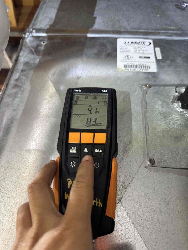 Completed heating maintenance on Lennox furnace system. Performed combustion analysis using Testo 310 analyzer, recording CO levels at 77-83 ppm and conducting safety diagnostics on burner operation. Inspection revealed significant rust corrosion and oxidation on interior base platform and metal components, indicating moisture exposure and age-related deterioration requiring monitoring for potential future repairs.