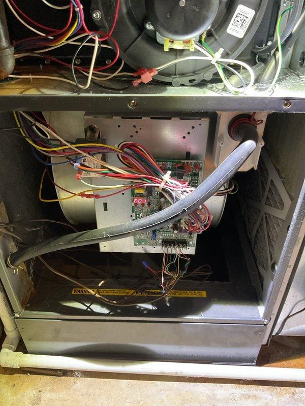 Completed comprehensive preventive maintenance on residential forced-air heating system. Performed thorough inspection of furnace cabinet, blower motor assembly, and all electrical connections. Verified proper operation of control board, checked wire terminations and safety interlocks, and confirmed all warning labels were intact and legible. Inspected ductwork, humidifier unit, and condensate drain lines throughout mechanical room for proper installation and functionality. All components found operating within normal parameters with no immediate service needs identified.