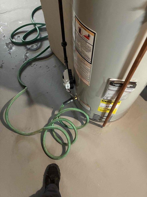 Completed first-year preventative maintenance on two HVAC systems, including heating and cooling components. Performed comprehensive inspection of air distribution system, including return air grilles and ductwork. Additionally conducted full maintenance service on tanked water heater, including sediment flushing as evidenced by hose drainage on basement floor, ensuring optimal performance and efficiency of all systems.