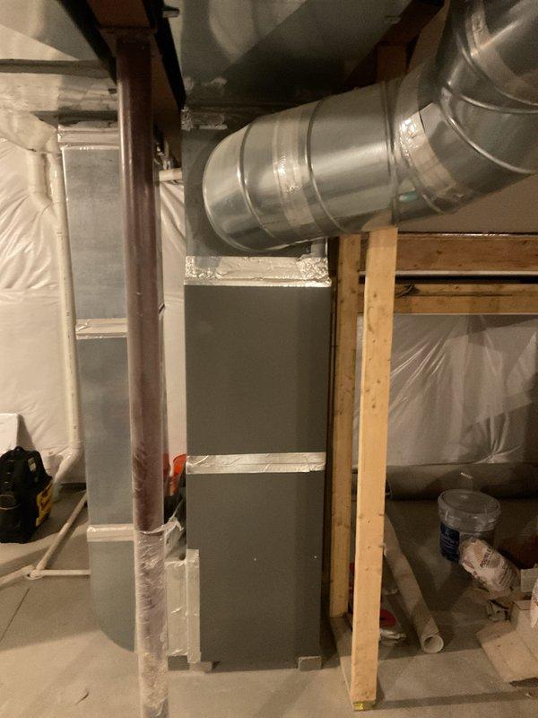 Completed comprehensive heating and cooling maintenance on residential HVAC system located in basement utility area. Performed standard maintenance procedures on furnace unit and associated ductwork, including inspection of sheet metal housing, ventilation connections, and air distribution system. Verified proper operation of PVC drainage lines, inspected gas supply connections, and confirmed all mechanical components were functioning within normal parameters for continued reliable system performance.