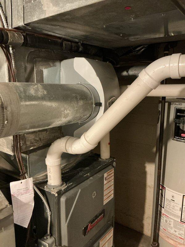 Performed comprehensive HVAC heating and cooling maintenance on residential split system with Amana furnace unit. Inspected mechanical room equipment, including furnace, ductwork, condensate drain lines, and electrical junction connections in response to reported areas with inadequate heating/cooling operation. Verified proper wiring connections at junction box, examined PVC venting and drainage systems, and assessed overall system functionality to address temperature control concerns throughout the residence.