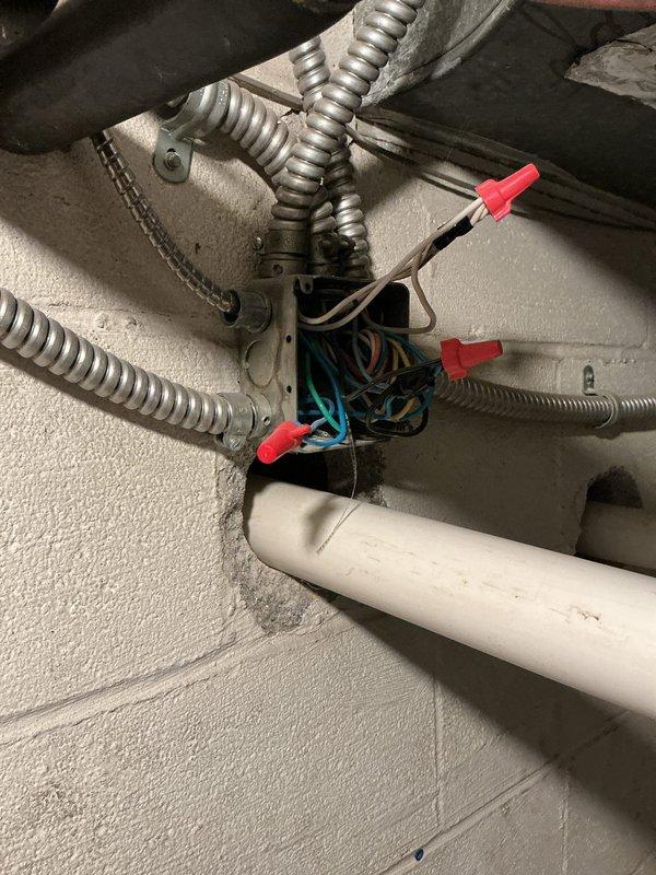 Performed comprehensive HVAC heating and cooling maintenance on residential split system with Amana furnace unit. Inspected mechanical room equipment, including furnace, ductwork, condensate drain lines, and electrical junction connections in response to reported areas with inadequate heating/cooling operation. Verified proper wiring connections at junction box, examined PVC venting and drainage systems, and assessed overall system functionality to address temperature control concerns throughout the residence.