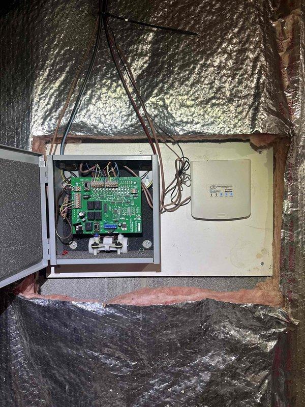 Responded to customer complaint regarding non-functional second floor zoning system. Accessed zone control panel in attic space, performed diagnostic testing of the zone control board and associated wiring using digital multimeter to verify power supply and circuit continuity. Inspected control board connections, damper actuator circuits, and thermostat wiring to identify the source of the zoning malfunction.