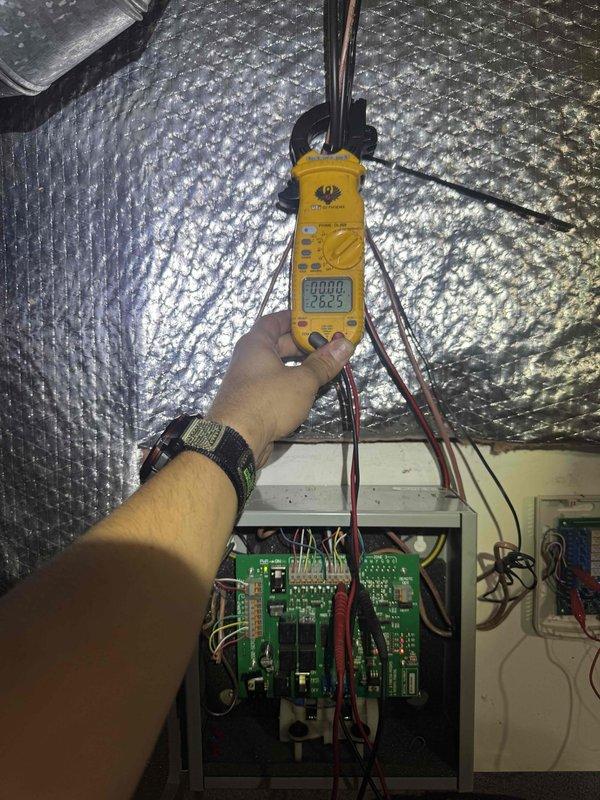 Responded to customer complaint regarding non-functional second floor zoning system. Accessed zone control panel in attic space, performed diagnostic testing of the zone control board and associated wiring using digital multimeter to verify power supply and circuit continuity. Inspected control board connections, damper actuator circuits, and thermostat wiring to identify the source of the zoning malfunction.