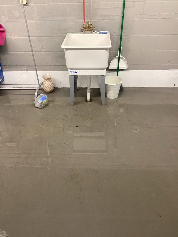 Responded to report of loud gurgling noises throughout all household sink drains. Upon arrival, discovered a significant pipe burst resulting in extensive flooding of the basement utility area with several inches of standing water covering the concrete floor. Identified the source of the leak in the plumbing system near the utility sink area where copper supply lines showed signs of failure. Shut off the main water supply to prevent further flooding and water damage. Assessed the extent of water infiltration, noting moisture damage along wall-floor junctions and previous water staining. Documented the flooded conditions and plumbing configuration for repair planning. The gurgling sounds reported by the customer were determined to be related to the compromised pipe system and drainage issues caused by the burst pipe event.