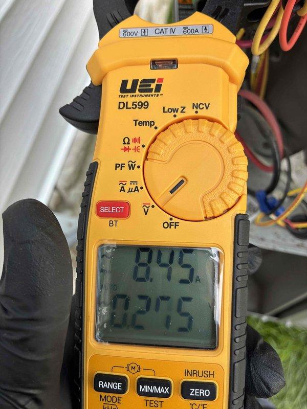 Completed scheduled preventive maintenance on residential air conditioning system. Performed comprehensive inspection of outdoor condensing unit, including visual examination of dual-run capacitor (CBB65A, 440V, 45+5 MFD) which showed proper specifications and secure electrical connections. Measured and recorded operating amperage at 0.45A and ambient temperature at 82.5°F using calibrated clamp meter. All electrical components, wiring connections, and capacitor functionality verified within normal operating parameters. System operating efficiently with no deficiencies noted.