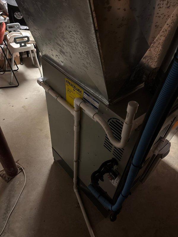 Completed installation of new air conditioning system at residential property. Installed outdoor condensing unit and connected refrigerant lines to existing furnace with compatible evaporator coil. Verified all electrical connections, tested system operation, and confirmed proper cooling performance before collecting final payment balance.