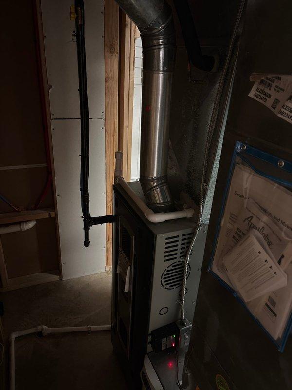 Completed installation of new air conditioning system at residential property. Installed outdoor condensing unit and connected refrigerant lines to existing furnace with compatible evaporator coil. Verified all electrical connections, tested system operation, and confirmed proper cooling performance before collecting final payment balance.