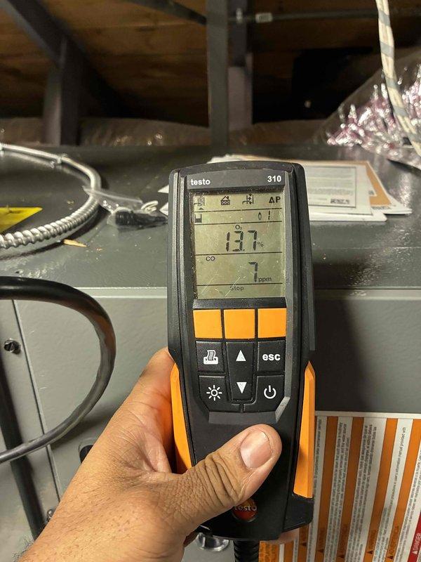 # HVAC First Year Heating Maintenance Completed

Performed comprehensive first-year heating maintenance on residential HVAC system. Conducted combustion analysis using Testo 310 analyzer, measuring carbon monoxide levels at 137 ppm to verify safe operation and proper burner combustion efficiency. Inspected indoor heating unit components, including heat exchanger, burner assembly, and ductwork connections. Evaluated outdoor unit electrical components, examining capacitor with multiple wire connections showing signs of weather exposure and aging. Noted corrosion and deterioration on outdoor electrical housing requiring monitoring for future service needs. All safety checks completed and system operational parameters documented for maintenance records.