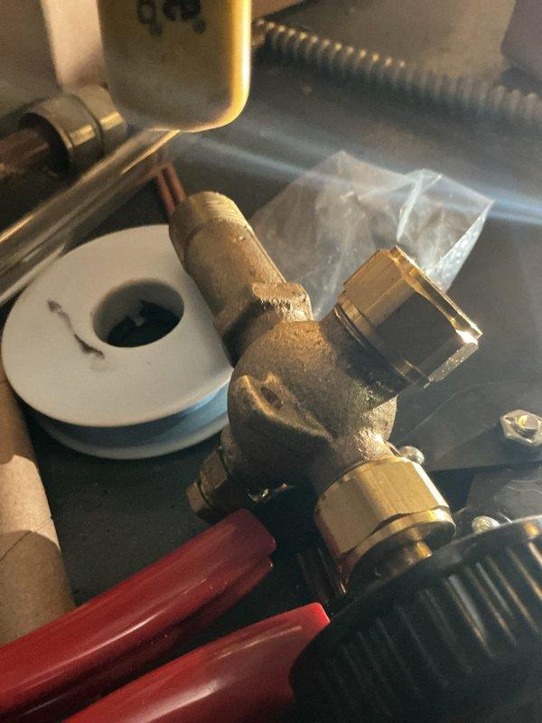 Replaced refrigerant sight glass and serviced condensate drain line on HVAC system. Installed new brass valves with shutoff controls and verified proper refrigerant flow visibility through sight glass. Applied thread sealant to all connections and tested system operation to ensure proper drainage and no leaks.
