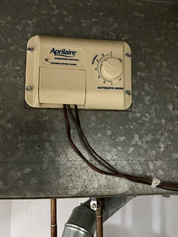 Completed comprehensive heating maintenance on residential HVAC system including furnace inspection and whole-house Aprilaire humidifier service. Verified humidifier control settings, checked water panel condition, inspected humidifier mounting and ductwork connections, and confirmed proper operation of all heating system components. All equipment found operating within normal parameters with no issues identified.