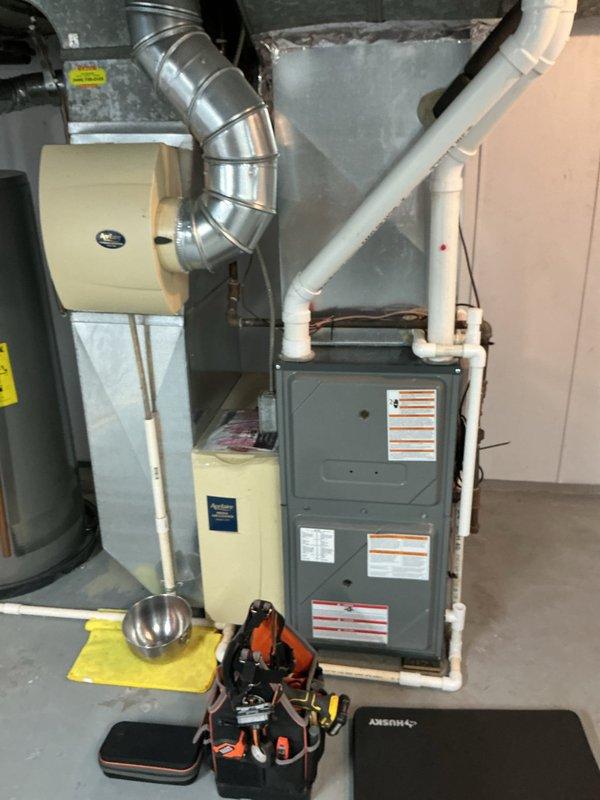 Completed comprehensive heating maintenance on residential HVAC system including furnace inspection and whole-house Aprilaire humidifier service. Verified humidifier control settings, checked water panel condition, inspected humidifier mounting and ductwork connections, and confirmed proper operation of all heating system components. All equipment found operating within normal parameters with no issues identified.