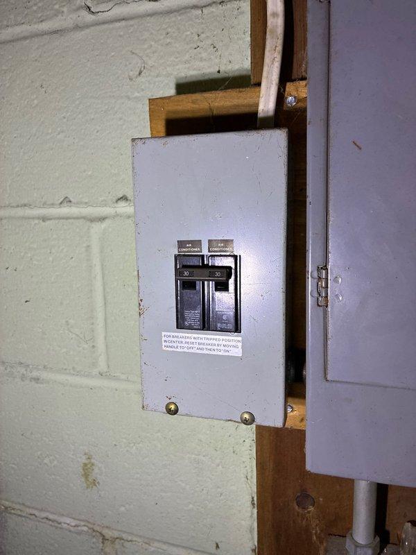 Conducted on-site assessment of existing Carrier furnace system in basement utility area to provide equipment replacement options. Evaluated current HVAC installation including furnace unit, ductwork configuration, electrical sub-panel connections, and PVC condensate drainage system. Documented existing equipment specifications and installation conditions through photographic documentation to develop comprehensive replacement proposal.