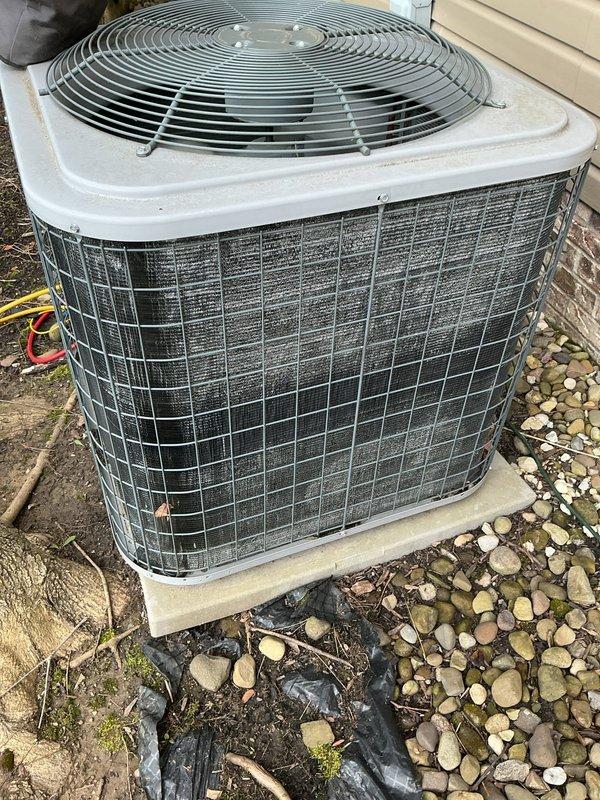 # HVAC Maintenance - Cooling System Service

Performed comprehensive annual maintenance on outdoor condensing unit experiencing continuous operation following thermostat upgrade. Upon arrival, found system disconnected by homeowner due to non-stop runtime issue. Conducted thorough inspection revealing heavily clogged condenser coils with extensive dirt, dust, and debris accumulation indicating deferred maintenance.

Performed complete coil cleaning to restore proper airflow and heat transfer efficiency. Cleaned protective wire grille and removed accumulated debris from unit exterior and surrounding area. Verified proper unit operation on concrete pad with adequate clearance from building structure and landscaping materials.

Addressed thermostat compatibility concerns and provided guidance on proper system operation following recent control upgrade. Evaluated unit placement and discussed relocation options as previously requested. System restored to normal operation with improved effic