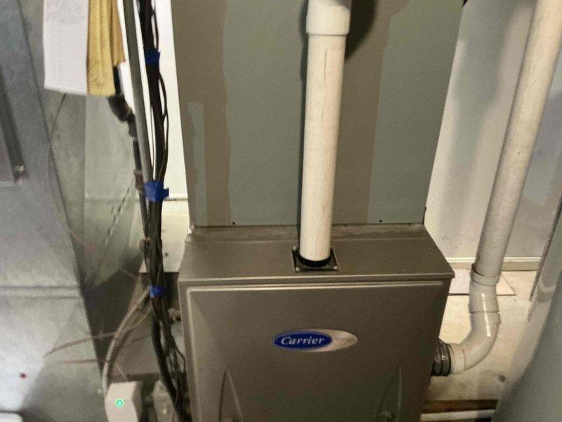 Responded to no cooling complaint and found system flat with no refrigerant charge. Evaluated existing Carrier furnace/air handler and outdoor condenser unit for homeowner preparing to sell property. Provided replacement options and estimate for new HVAC system installation, as current equipment requires significant repair and refrigerant recharge to restore cooling function.