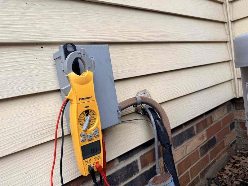 Responded to service call for air conditioning system not cooling properly. Upon arrival, performed electrical diagnostics on outdoor condensing unit using clamp meter and multimeter to measure voltage, amperage, and continuity. Tested electrical disconnect, control panel, and system components to identify cooling deficiency and ensure proper operation of the unit.