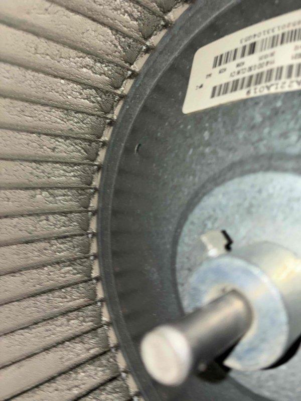 Completed comprehensive HVAC maintenance on dual heating and cooling systems, including inspection of blower wheel assembly showing normal dust accumulation and operational condition. Performed electrical diagnostics on outdoor condensing unit using multimeter to verify proper voltage and system performance, with all components functioning within manufacturer specifications.