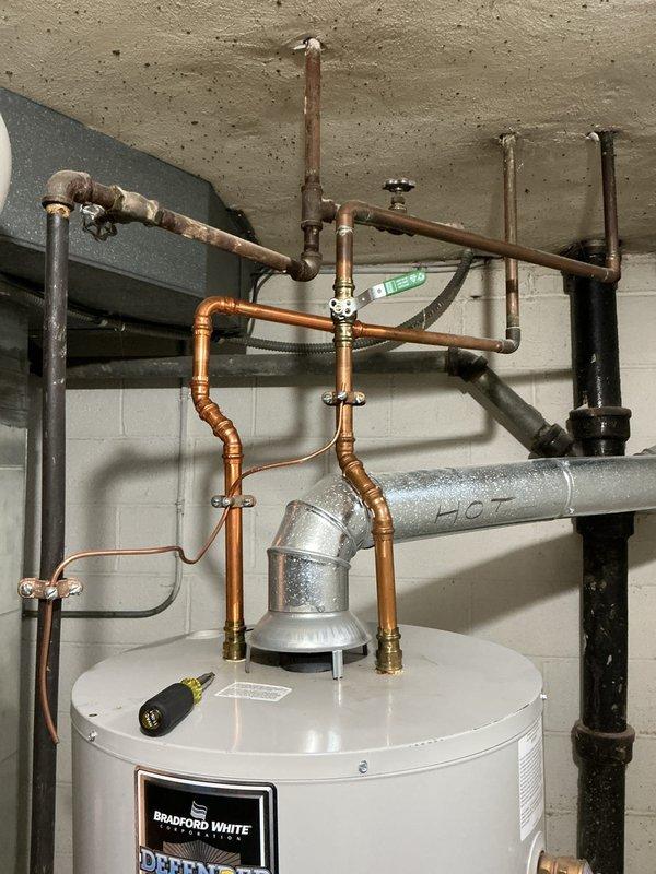 Performed routine maintenance flush on Bradford White tanked water heater unit. Drained sediment buildup from tank bottom, cleared mineral deposits, and verified proper operation of temperature-pressure relief valve. Inspected all copper and galvanized piping connections, shut-off valves, and fittings for leaks or corrosion—all found secure and functioning properly. System refilled, tested, and returned to normal operation.