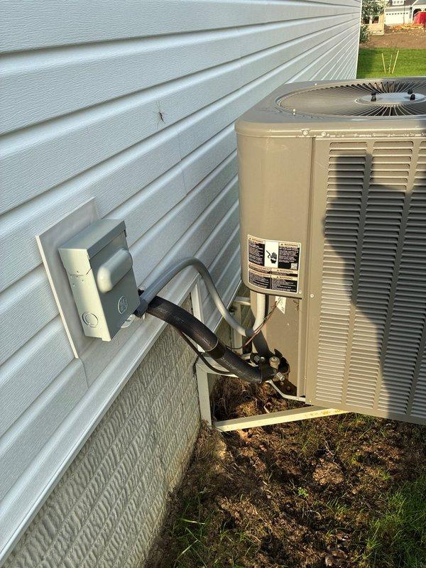Conducted site assessment for new generator installation at residential property. Evaluated existing electrical infrastructure including HVAC system location and outdoor condenser unit placement. Documented measurements and created site sketch showing spatial relationships between furnace, ground level, and street access. Recorded dimensions including 6½' and 2½' clearances for equipment positioning. Identified gravel pad area and optimal generator placement location relative to existing electrical disconnect box and refrigerant lines. Photographed current HVAC setup with wall-mounted disconnect and condenser unit on grade to determine electrical service routing requirements. Prepared comprehensive estimate for generator installation including necessary electrical connections, transfer switch, and proper clearances per manufacturer specifications and local code requirements.