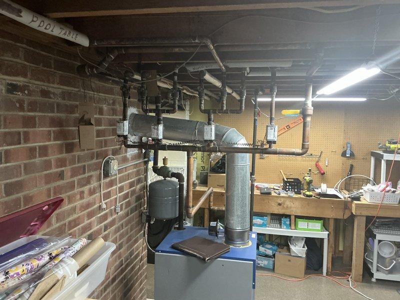 Completed HVAC estimate for existing boiler system located in basement utility area. Customer requested pricing for replacement due to age and anticipated failure of current unit. Documented existing system configuration including boiler, water heater, ductwork, and associated piping for accurate replacement quote preparation.