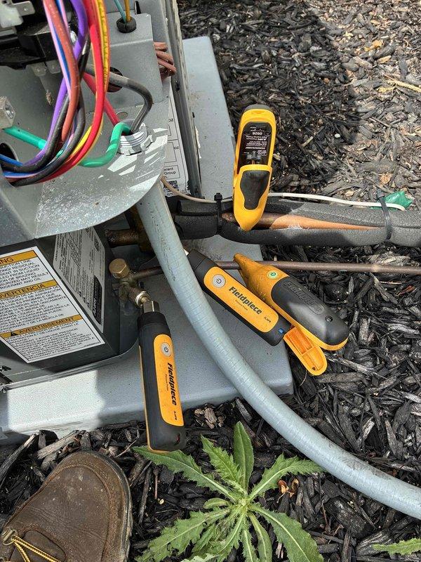 Completed first-year cooling system maintenance on residential outdoor condensing unit. Performed comprehensive system inspection, tested electrical connections and refrigerant pressures using diagnostic instruments, verified proper fan operation, and confirmed unit specifications. All components operating within normal parameters with no issues identified.