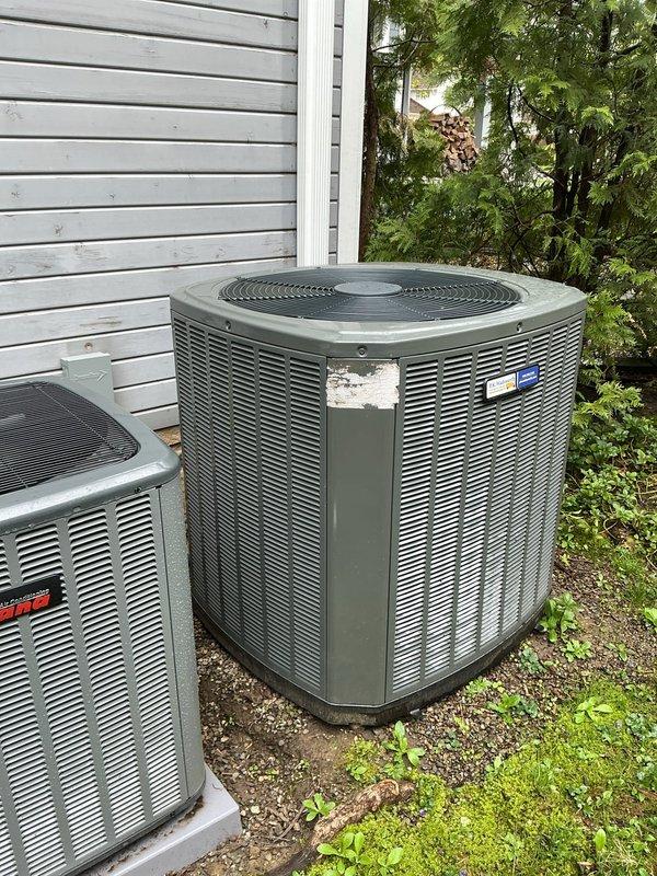 Responded to no cooling call for two residential AC units that simultaneously stopped operating. Found both thermostats placed on hold mode at 70°F setpoint while indoor temperature had risen to 74°F. Cleared hold settings on both thermostats, restoring normal cooling operation to the 2-month-old and 2-year-old systems.