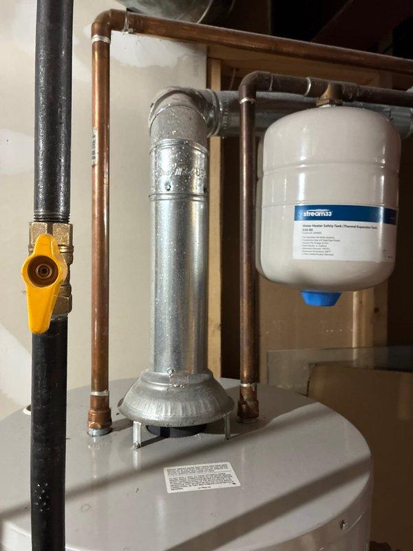 Conducted comprehensive assessment of existing HVAC system in basement location to provide furnace replacement options. Documented current equipment configuration including water heater installation with expansion tank and filtration components, as well as exterior condensing unit with electrical connections. Photographed existing setup to develop accurate replacement proposal and equipment specifications for customer consideration.