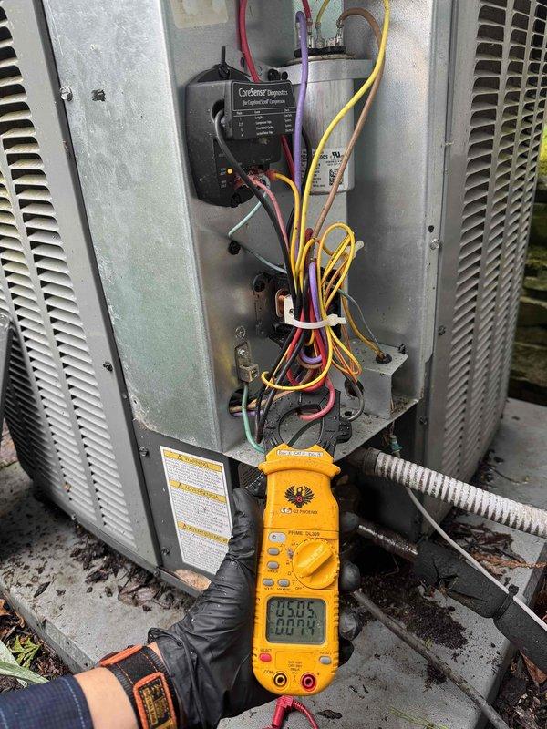 Completed seasonal cooling maintenance on two HVAC systems as part of recurring preventive service plan. Performed comprehensive electrical diagnostics on first unit, including voltage and amperage measurements using digital multimeter to verify proper compressor operation and electrical component functionality. Inspected internal wiring, connections, and control systems with panel access. Verified CorSense monitoring system operational status. Conducted temperature differential measurements on second system at supply ductwork and refrigerant lines to confirm adequate cooling performance and proper airflow. Both systems tested within normal operating parameters with no deficiencies identified requiring immediate attention.