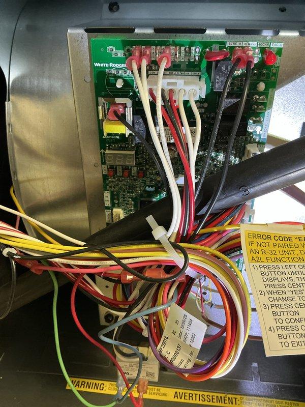 Responded to service call for communication failure between thermostat and air conditioning system on recently installed furnace. Upon arrival, inspected Lennox outdoor condenser unit and verified physical installation integrity. Accessed furnace control panel and examined White-Rodgers control board wiring connections. Diagnosed communication protocol issue preventing thermostat from establishing connection with cooling system. Verified all low-voltage wiring terminations at control board, checked wire continuity between indoor and outdoor units, and confirmed proper configuration settings on control board. Reprogrammed thermostat pairing sequence per manufacturer specifications and successfully established communication link between thermostat and air conditioning system. Cycled system through cooling mode to verify proper operation and confirmed thermostat now controlling both heating and cooling functions as designed. System tested and operational.