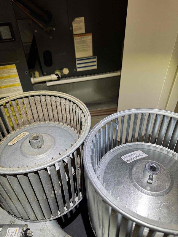Replaced contaminated blower wheel assembly in air handler unit due to excessive dust and debris accumulation affecting system performance. Removed heavily soiled squirrel-cage blower wheel and installed new assembly, restoring proper airflow and operational efficiency to the HVAC system.