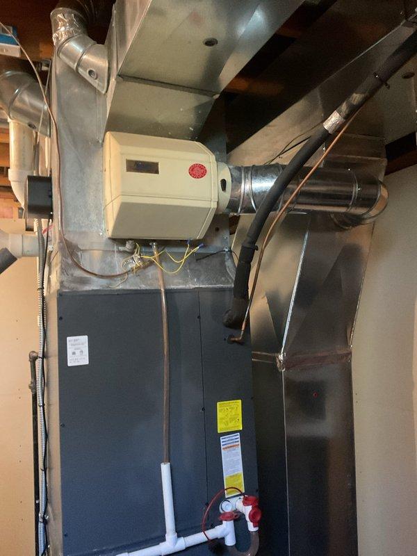 Completed routine heating maintenance on residential forced-air furnace system with integrated humidifier. Performed comprehensive inspection of all major components including heat exchanger, burner assembly, blower motor, and venting system. Verified proper operation of humidifier unit, checked drainage lines and gas supply connections, and confirmed all safety labels and manufacturer specifications were clearly visible and intact.