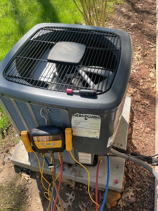 # HVAC Cooling System Maintenance Completed

Performed comprehensive preventive maintenance on residential air conditioning system. Connected digital manifold gauge set to service ports and verified refrigerant pressures and system operating parameters. All refrigerant levels found to be within manufacturer specifications with no leaks detected. Inspected condensing unit exterior condition, fan operation, and electrical connections. Confirmed proper airflow through condenser coil and fan guard assembly. System tested and operating efficiently with no issues identified.