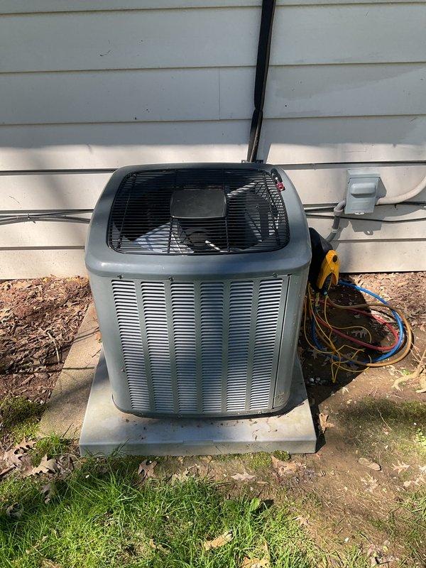 # HVAC Cooling System Maintenance Completed

Performed comprehensive preventive maintenance on residential air conditioning system. Connected digital manifold gauge set to service ports and verified refrigerant pressures and system operating parameters. All refrigerant levels found to be within manufacturer specifications with no leaks detected. Inspected condensing unit exterior condition, fan operation, and electrical connections. Confirmed proper airflow through condenser coil and fan guard assembly. System tested and operating efficiently with no issues identified.