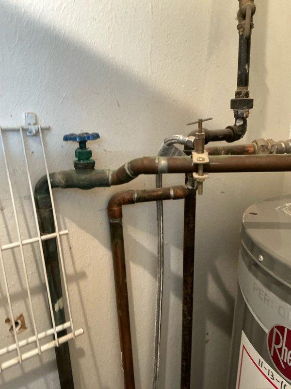 Provided comprehensive estimate for complete HVAC system replacement including existing water heater upgrade and installation of new heating and cooling equipment for home addition. Assessed current plumbing infrastructure showing significant corrosion on copper piping and evaluated existing Rheem water heater for replacement, while also reviewing ductwork installation requirements for extending climate control to additional living space.